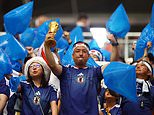 The REAL heroes of the World Cup: Classy Japan fans clean up after themselves following draw against the Netherlands